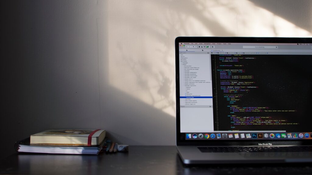 MacBook Pro showing programming language – 10 Best AI WordPress Plugins to Automate Your Workflow