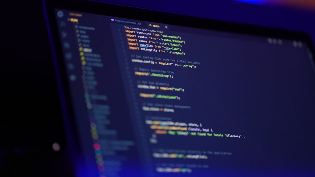 Laptop screen displaying colorful code – How to Use Cloudflare Bot Preference Sync to Automate Robots.txt