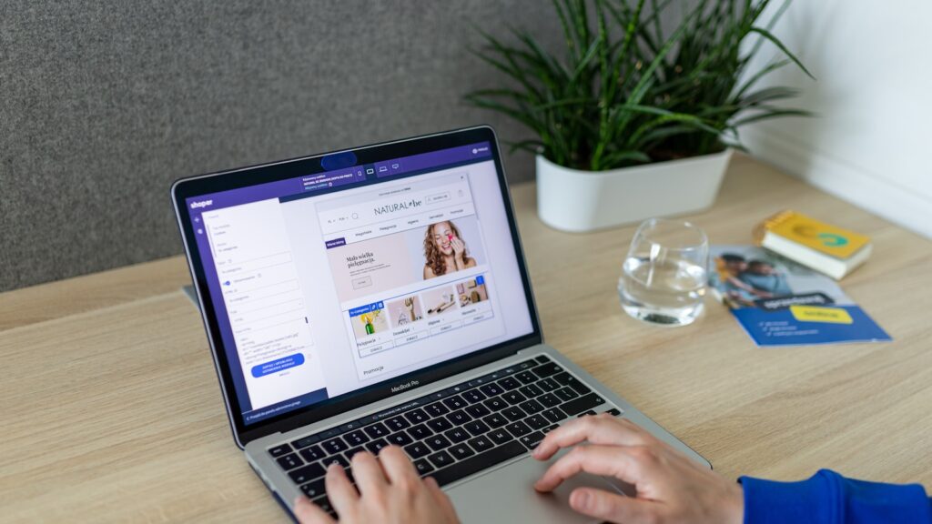A person typing on a laptop on a table – Understanding DataViews and DataForms: The Next-Generation Architecture for WordPress and WooCommerce Admin S